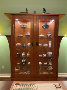 Custom two door inlaid cherry china display cabinet with adjustable glass shelves and remote light controls.